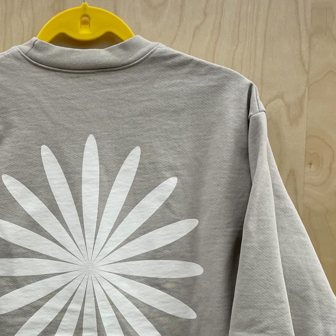 The logo on the back of a tshirt.